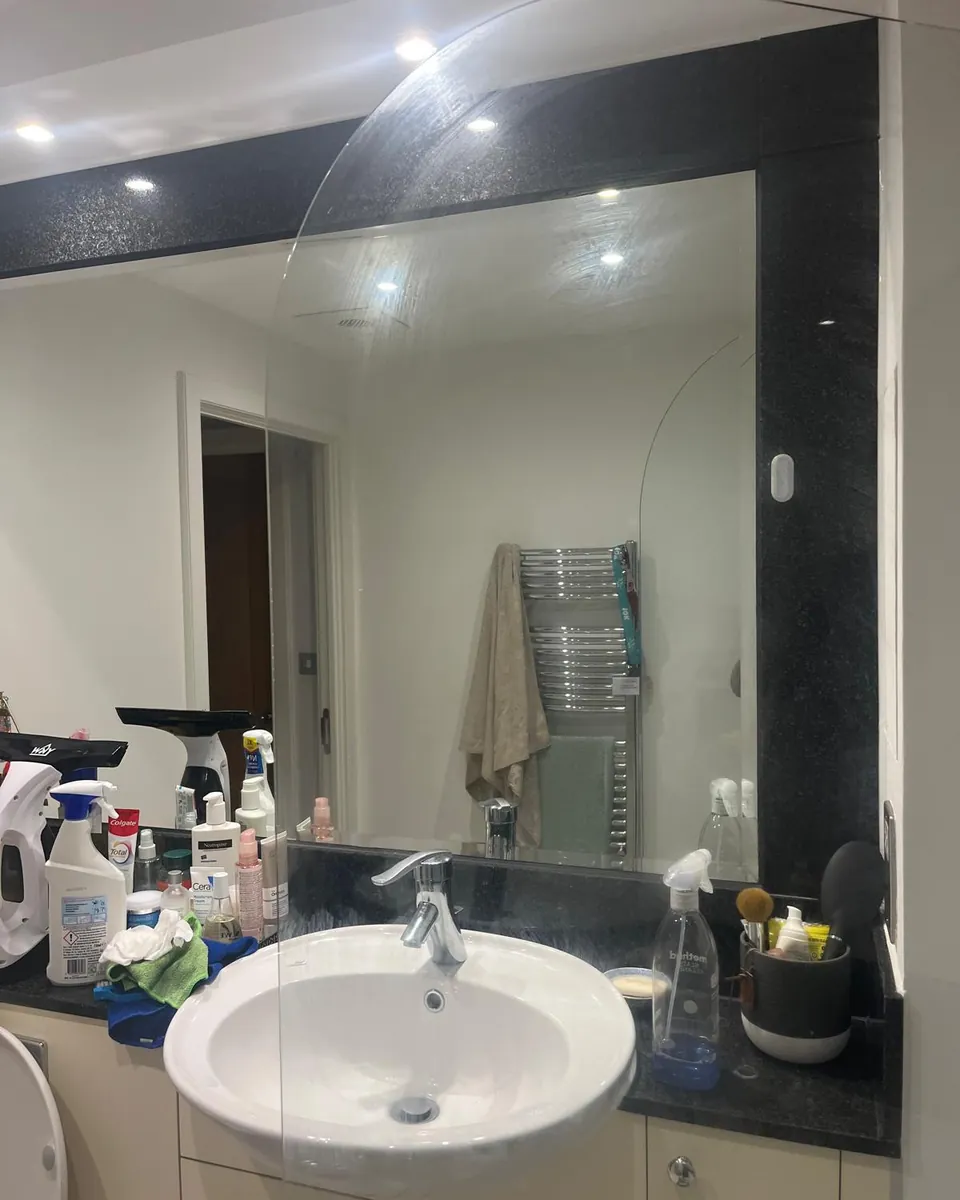 Bathroom mirror and shower screen after cleaning by Stay Flow Cleaners